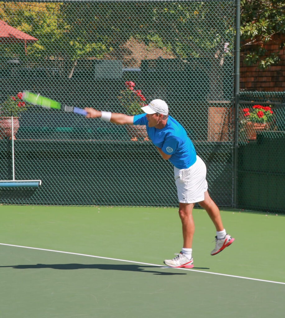 Scott Howard tennis serve mid swing